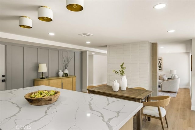 121 W Borromeo Ave, Placentia, CA 92870 - kitchen with recessed lighting, light wood-type flooring, and light stone countertops