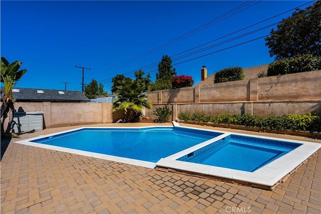 121 W Borromeo Ave, Placentia, CA 92870 - view of swimming pool featuring a fenced backyard, a patio, and a pool with connected hot tub