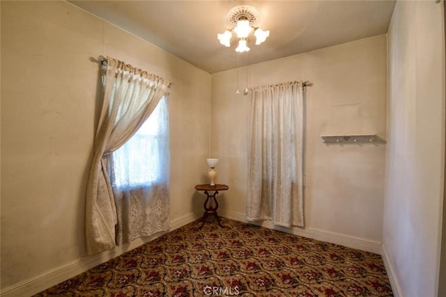 937 E 6th St, Madera, CA 93638 - spare room with baseboards and carpet floors