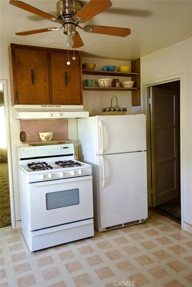 937 E 6th St, Madera, CA 93638 - kitchen featuring white appliances, a ceiling fan, under cabinet range hood, and brown cabinetry