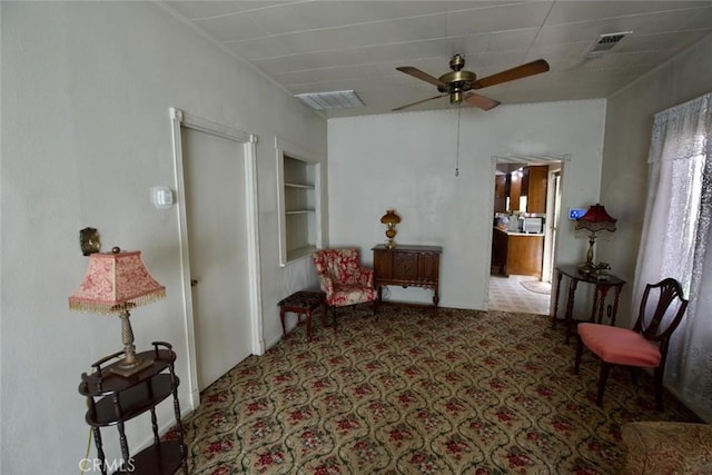 937 E 6th St, Madera, CA 93638 - sitting room featuring ceiling fan and built in shelves