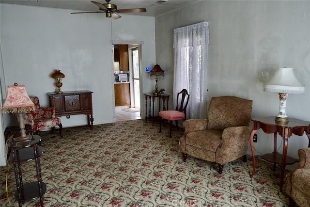 937 E 6th St, Madera, CA 93638 - living area with ceiling fan and carpet floors