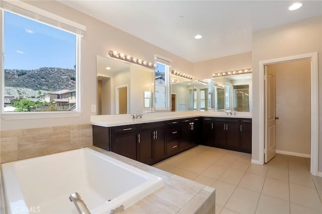 28245 Nield Ct, Saugus, CA 91350 - full bath with double vanity, a bath, tile patterned floors, a mountain view, and recessed lighting