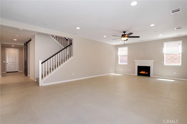 28245 Nield Ct, Saugus, CA 91350 - unfurnished living room with stairway, a ceiling fan, recessed lighting, a warm lit fireplace, and light tile patterned flooring