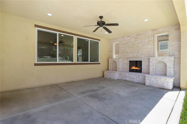 28245 Nield Ct, Saugus, CA 91350 - view of patio with a ceiling fan and an outdoor stone fireplace