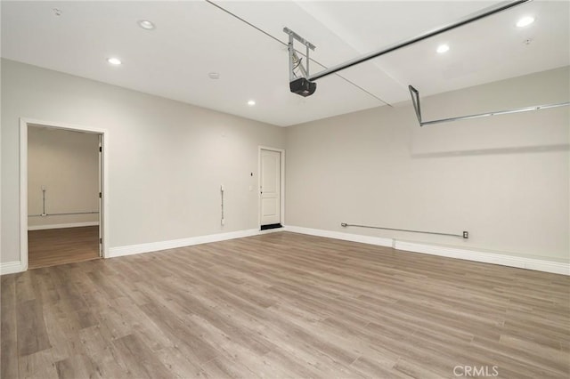 28245 Nield Ct, Saugus, CA 91350 - garage featuring a garage door opener and recessed lighting