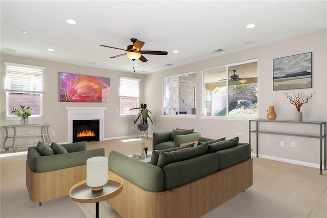 28245 Nield Ct, Saugus, CA 91350 - living area with ceiling fan, a lit fireplace, and recessed lighting