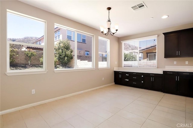 28245 Nield Ct, Saugus, CA 91350 - kitchen featuring a chandelier, plenty of natural light, light countertops, and decorative light fixtures