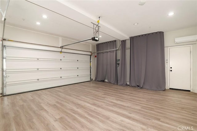 28245 Nield Ct, Saugus, CA 91350 - garage with a wall mounted air conditioner, a garage door opener, and recessed lighting