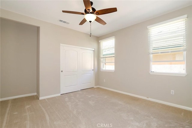 28245 Nield Ct, Saugus, CA 91350 - unfurnished bedroom featuring light colored carpet, a closet, and a ceiling fan