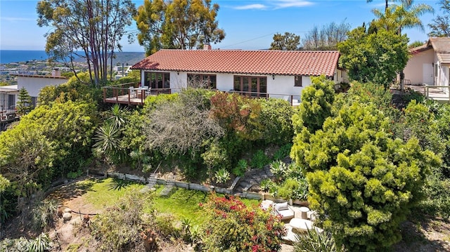 2575 Temple Hills Dr, Laguna Beach, CA 92651 - view of front of home with a tiled roof, stucco siding, and a chimney