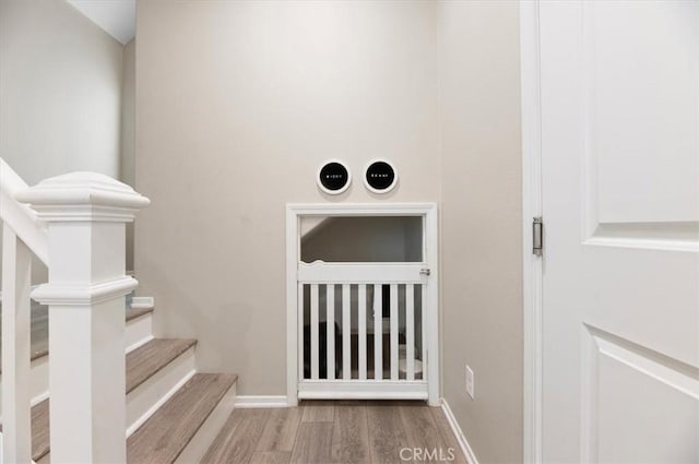 7346 Garnet Ridge Rd, Jurupa Valley, CA 92509 - staircase with wood finished floors and baseboards