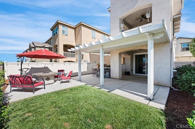 7346 Garnet Ridge Rd, Jurupa Valley, CA 92509 - rear view of property featuring stucco siding, a patio area, and an outdoor fire pit