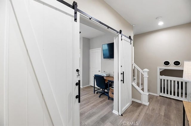 7346 Garnet Ridge Rd, Jurupa Valley, CA 92509 - office space featuring a barn door, light wood-style flooring, and recessed lighting
