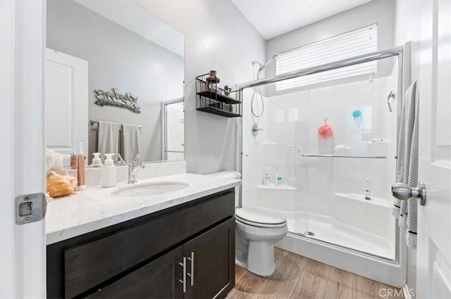7346 Garnet Ridge Rd, Jurupa Valley, CA 92509 - bathroom featuring a shower stall, vanity, and wood finished floors