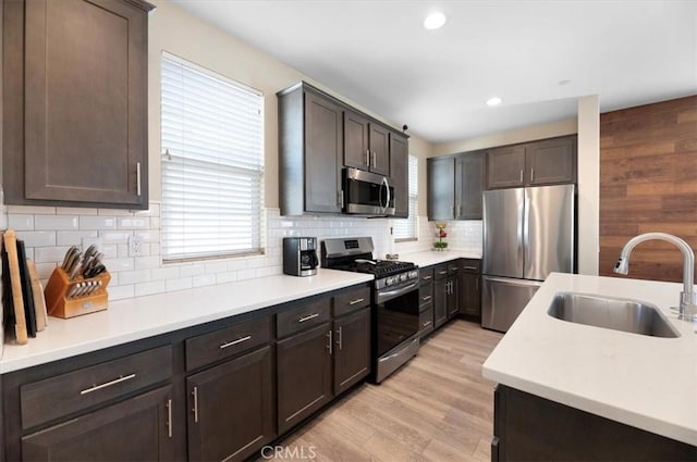 7346 Garnet Ridge Rd, Jurupa Valley, CA 92509 - kitchen with stainless steel appliances, light countertops, dark brown cabinetry, backsplash, and recessed lighting