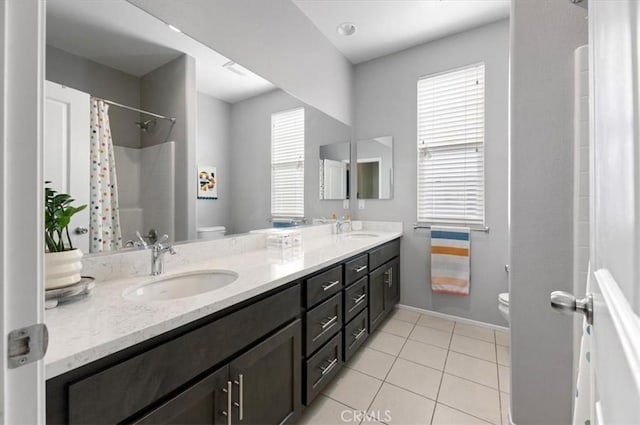 7346 Garnet Ridge Rd, Jurupa Valley, CA 92509 - bathroom featuring double vanity, plenty of natural light, tile patterned flooring, and curtained shower
