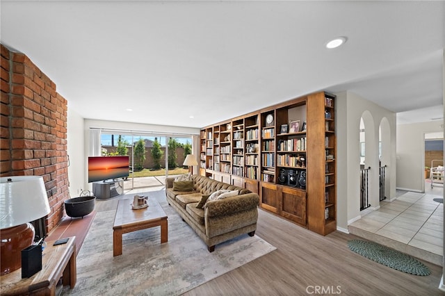 20822 Skimmer Ln, Huntington Beach, CA 92646 - living area featuring wood finished floors and arched walkways