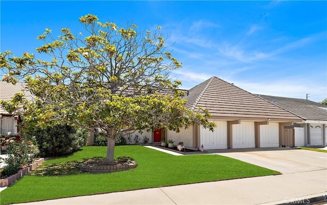 20822 Skimmer Ln, Huntington Beach, CA 92646 - view of front of house with concrete driveway, a garage, a front yard, and a tile roof