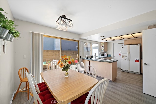 20822 Skimmer Ln, Huntington Beach, CA 92646 - dining area with light wood-style flooring