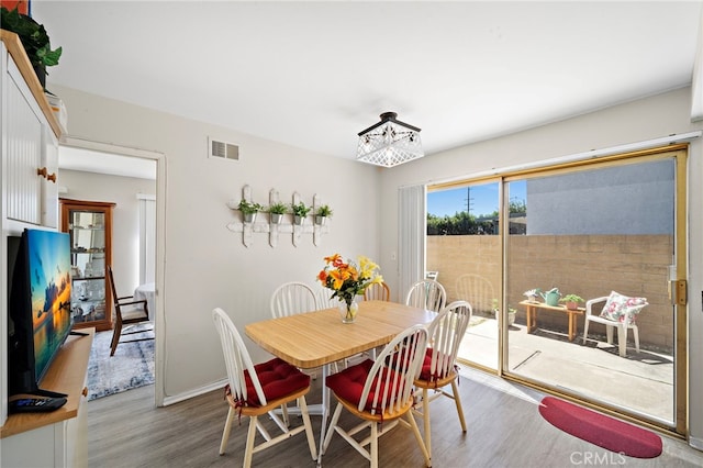 20822 Skimmer Ln, Huntington Beach, CA 92646 - dining space featuring wood finished floors and baseboards