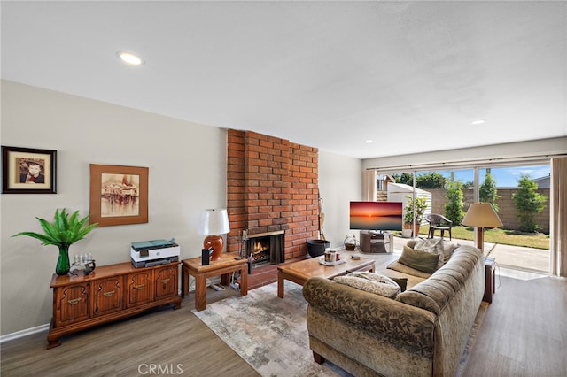 20822 Skimmer Ln, Huntington Beach, CA 92646 - living room with wood finished floors, a fireplace, and recessed lighting