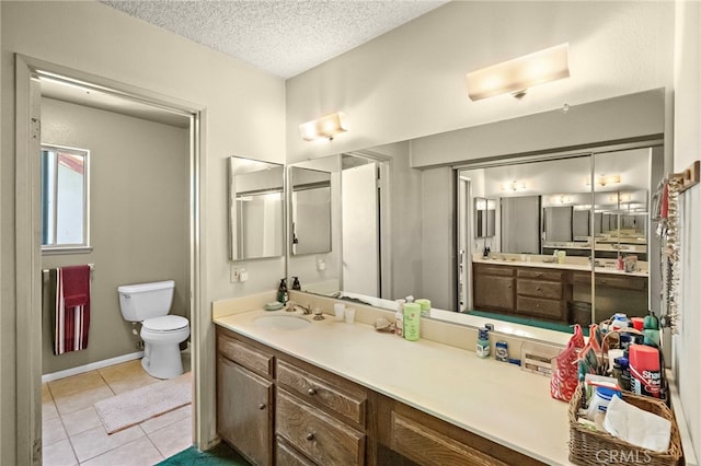 20822 Skimmer Ln, Huntington Beach, CA 92646 - full bath with vanity, tile patterned flooring, and a textured ceiling