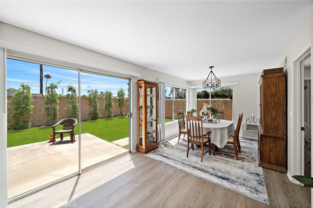 20822 Skimmer Ln, Huntington Beach, CA 92646 - dining space with wood finished floors and a chandelier