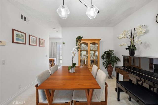 53 Misty Run Unit 10, Irvine, CA 92614 - dining room with light colored carpet and a textured ceiling