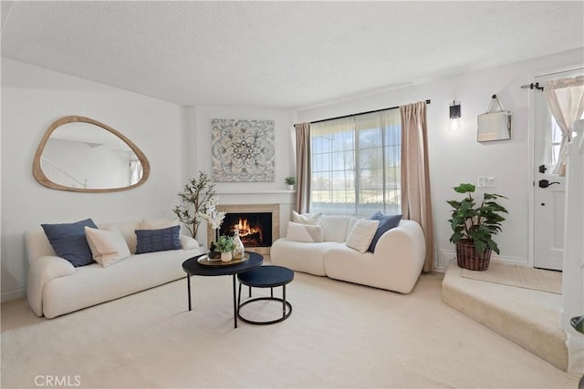 53 Misty Run Unit 10, Irvine, CA 92614 - carpeted living area with a textured ceiling and a warm lit fireplace