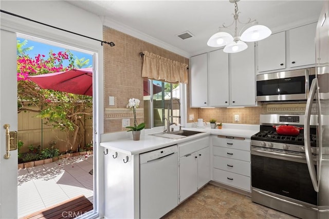 53 Misty Run Unit 10, Irvine, CA 92614 - kitchen featuring stainless steel appliances, light countertops, a chandelier, white cabinetry, and decorative backsplash