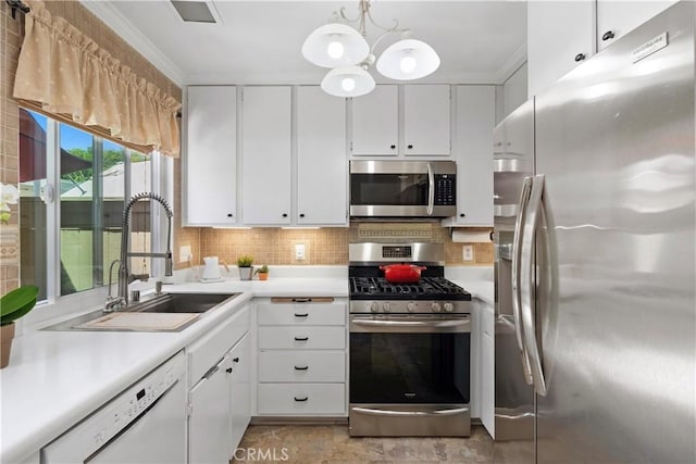 53 Misty Run Unit 10, Irvine, CA 92614 - kitchen with appliances with stainless steel finishes, crown molding, light countertops, white cabinetry, and decorative backsplash
