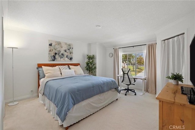 53 Misty Run Unit 10, Irvine, CA 92614 - bedroom featuring light colored carpet, ornamental molding, a textured ceiling, and access to outside