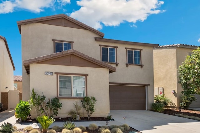 32985 Middlegate Pl, Lake Elsinore, CA 92530 - view of front of property featuring an attached garage, driveway, and stucco siding