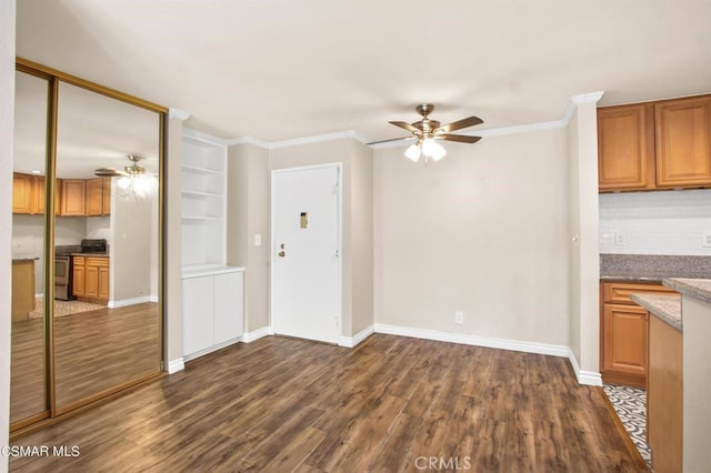 5585 E Pacific Coast Hwy Unit 154, Long Beach, CA 90804 - unfurnished living room with ceiling fan, dark wood-style flooring, and ornamental molding