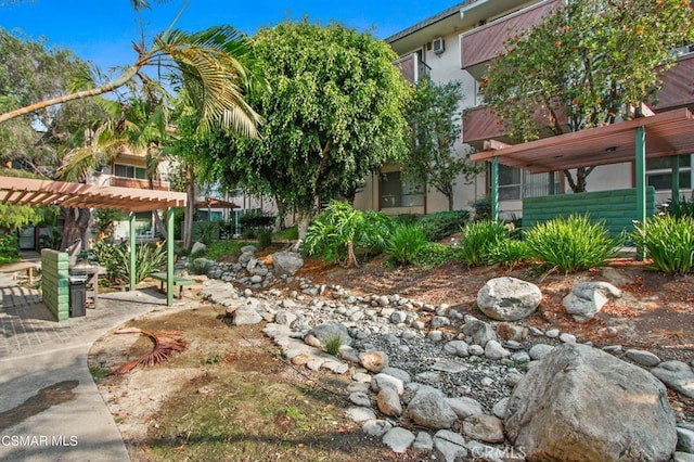 5585 E Pacific Coast Hwy Unit 154, Long Beach, CA 90804 - surrounding community featuring a pergola and a patio area