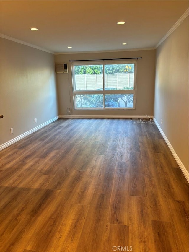 5585 E Pacific Coast Hwy Unit 154, Long Beach, CA 90804 - spare room featuring a wall unit AC, dark wood-type flooring, ornamental molding, and recessed lighting