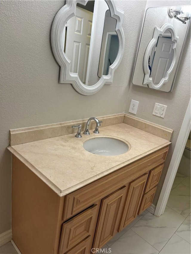 5585 E Pacific Coast Hwy Unit 154, Long Beach, CA 90804 - bathroom with vanity and marble finish flooring