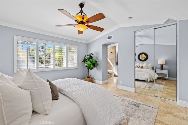 31 Cayman Brac, Aliso Viejo, CA 92656 - tiled bedroom featuring arched walkways, vaulted ceiling, crown molding, a closet, and connected bathroom