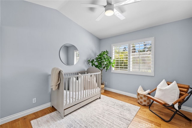 31 Cayman Brac, Aliso Viejo, CA 92656 - bedroom featuring lofted ceiling, a nursery area, wood finished floors, and a ceiling fan