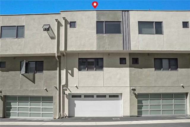 2930 Rowena Ave Unit 4, Los Angeles, CA 90039 - view of building exterior with an attached garage