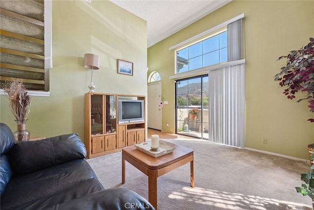 14325 Foothill Blvd Unit 34, Sylmar, CA 91342 - carpeted living area featuring a towering ceiling and healthy amount of natural light