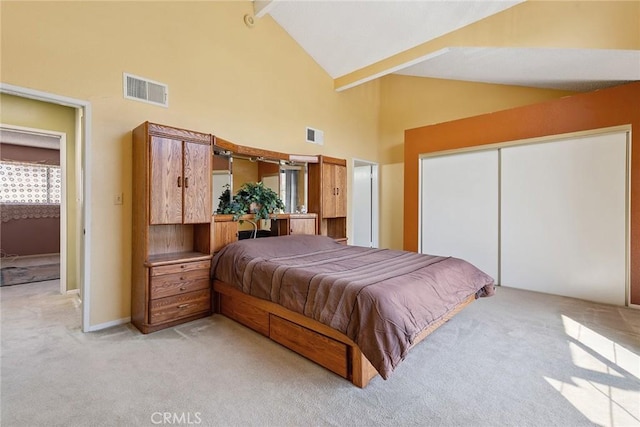14325 Foothill Blvd Unit 34, Sylmar, CA 91342 - bedroom with light carpet, high vaulted ceiling, beam ceiling, and a closet