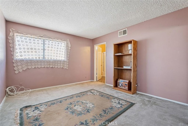 14325 Foothill Blvd Unit 34, Sylmar, CA 91342 - carpeted spare room featuring a textured ceiling and baseboards