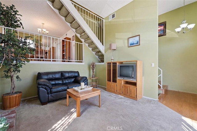 14325 Foothill Blvd Unit 34, Sylmar, CA 91342 - living area with a chandelier, carpet floors, high vaulted ceiling, and stairs
