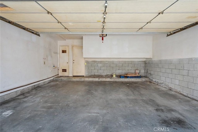 14325 Foothill Blvd Unit 34, Sylmar, CA 91342 - garage featuring concrete block wall