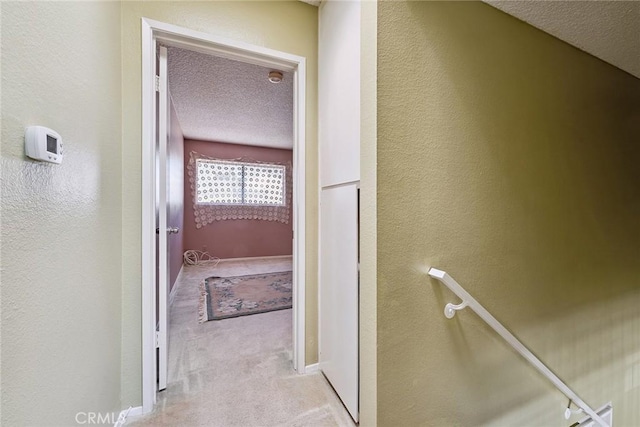 14325 Foothill Blvd Unit 34, Sylmar, CA 91342 - hall featuring a textured ceiling, carpet, and a textured wall