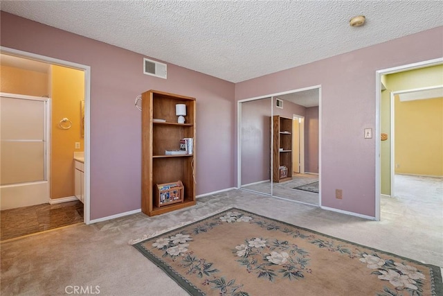 14325 Foothill Blvd Unit 34, Sylmar, CA 91342 - unfurnished bedroom with carpet flooring, a closet, a textured ceiling, and ensuite bathroom