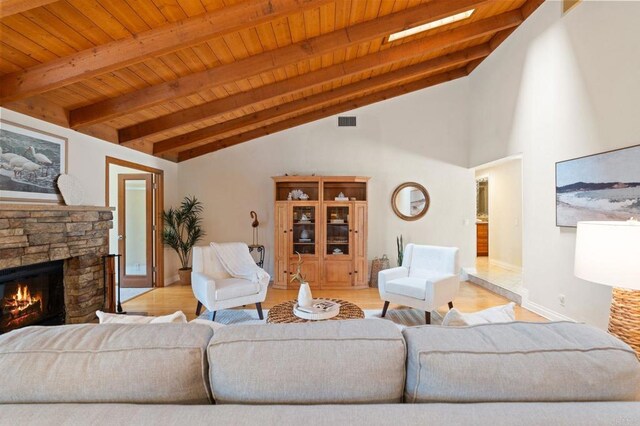 1740 Fire Mountain Dr, Oceanside, CA 92054 - living room with wood ceiling, a stone fireplace, and wood finished floors
