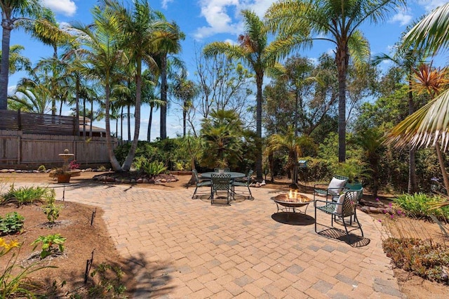 1740 Fire Mountain Dr, Oceanside, CA 92054 - view of patio featuring an outdoor fire pit and outdoor dining area